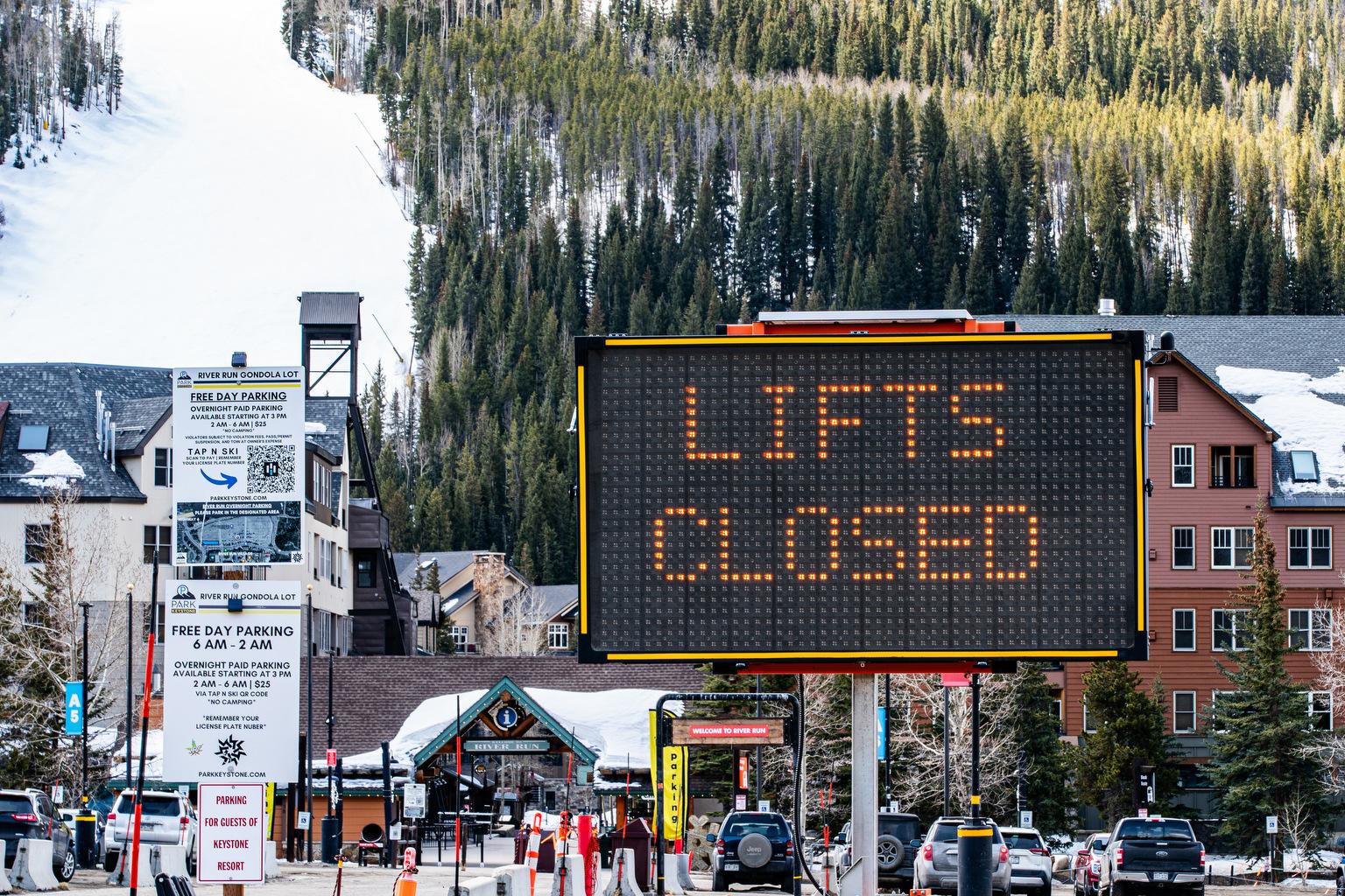 A sign says "lifts closed" for the 2024-25 ski season at Keystone