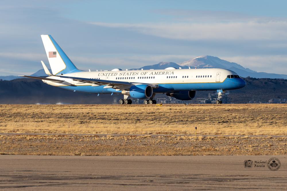 a jet with mountains behind it